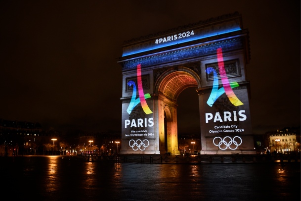 The campaign's official logo of the Paris bid to host the 2024 Olympic Games is seen on the Arc de Triomphe in Paris on February 9, 2016. AFP PHOTO / LIONEL BONAVENTURE / AFP / LIONEL BONAVENTURE